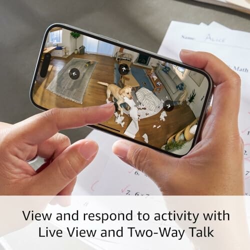 Person using smartphone with live view of home security camera and two-way talk feature.