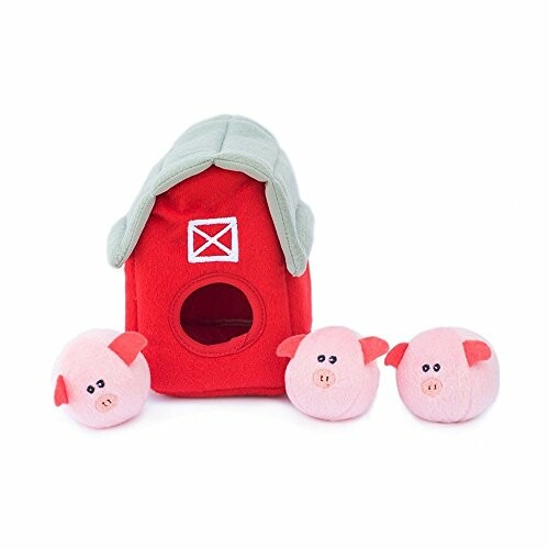 Plush red barn with three small pink pig toys.