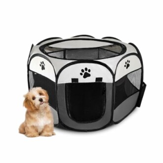 Portable pet playpen with a small dog sitting beside it.